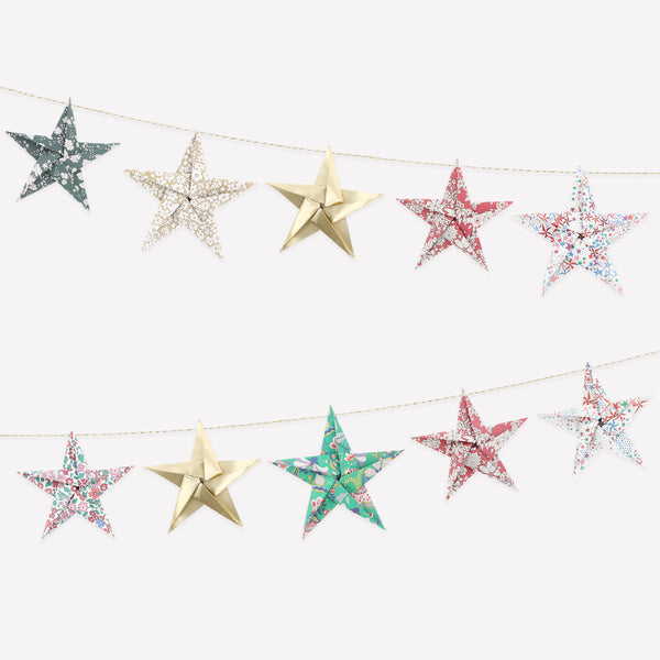 Let our star garland, designed with joyful Liberty star and floral prints and gold foil details, add an elegant touch to your Christmas décor. Image1