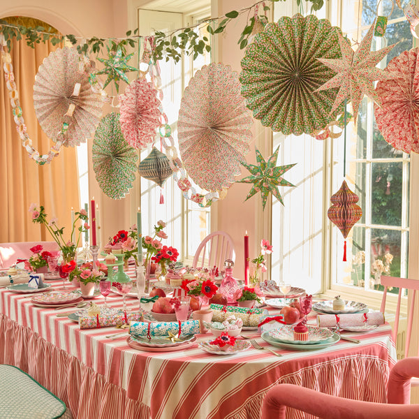 Our Christmas hanging decorations set features 3 paper Liberty floral print pinwheels with velvet hanging ribbons, perfect for an elegant look. Image2