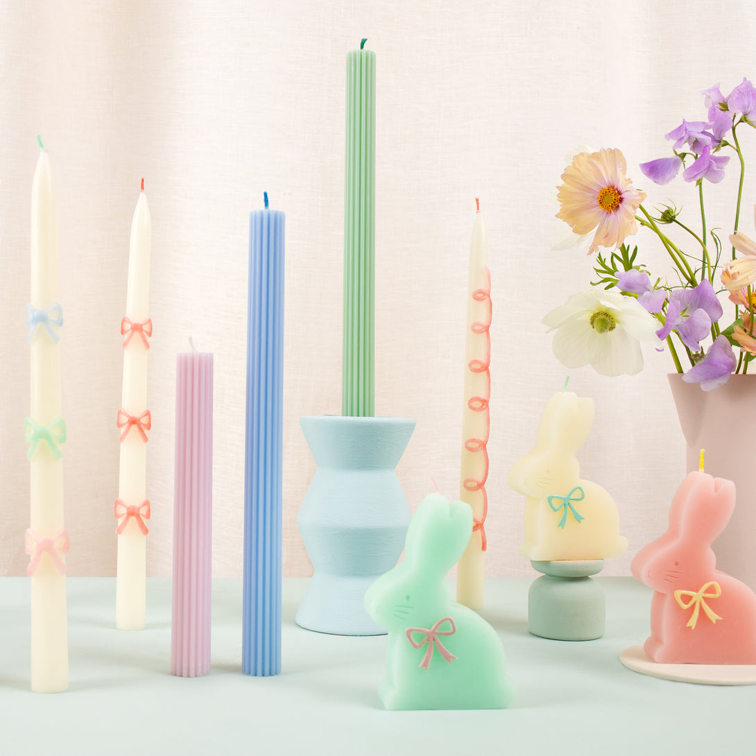 Our party candles, crafted in a tapered shape with embossed and handpainted pastel bows, have mint green wicks.