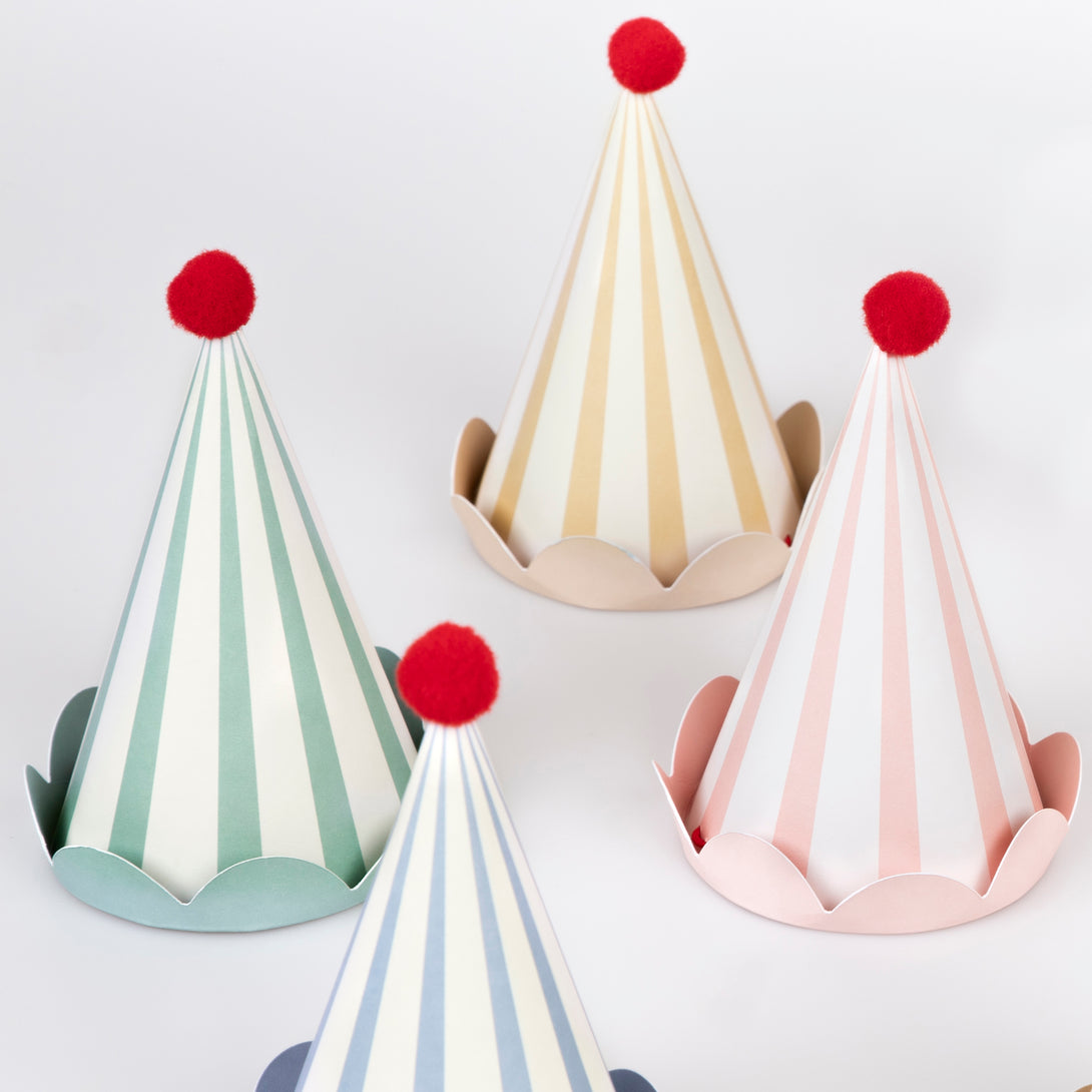 Our paper hats feature pastel stripes, fun red pompoms and scalloped details, they're ideal as birthday party hats for ages 3+.