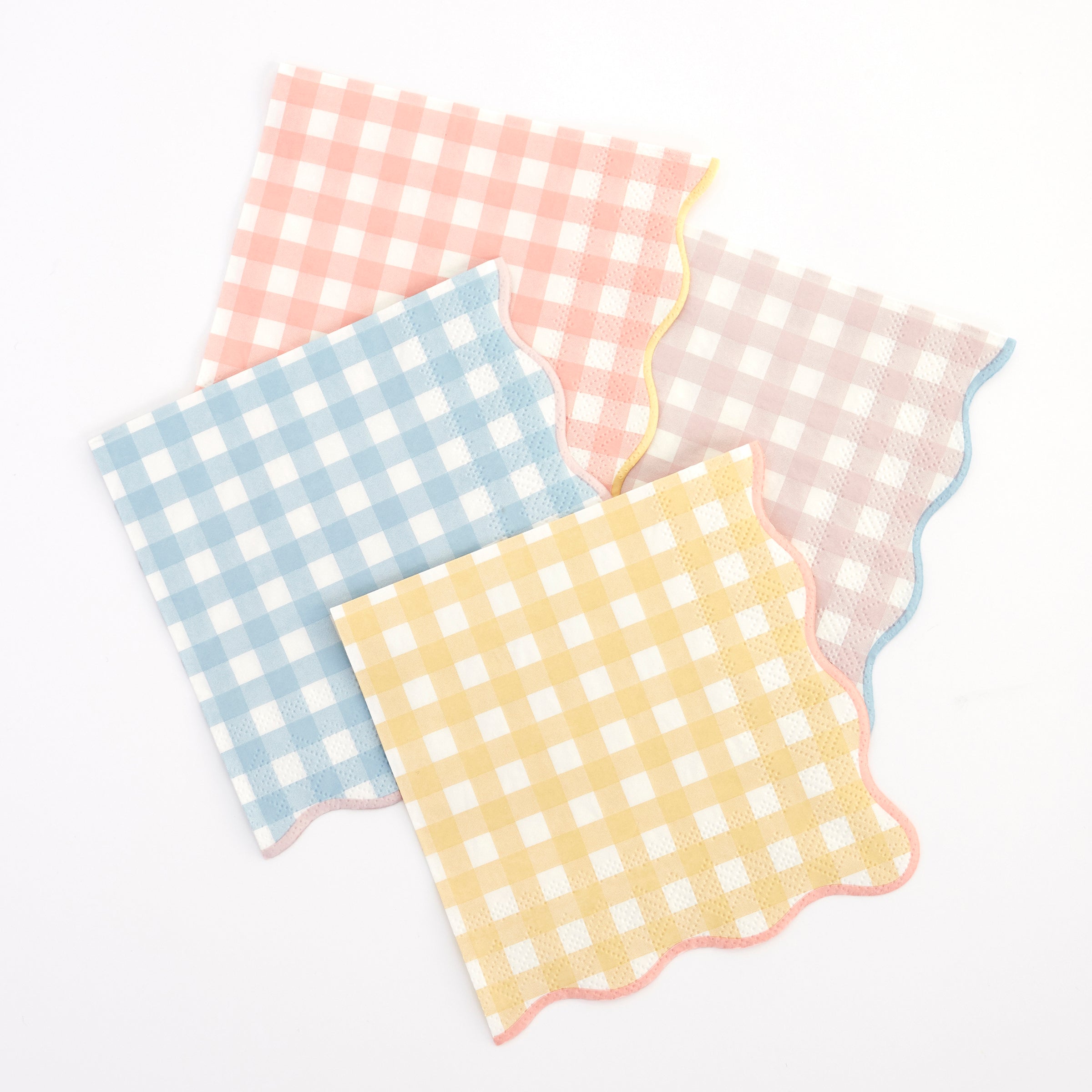 Our disposable napkins with a gingham print and scalloped edge will look amazing on your party table.