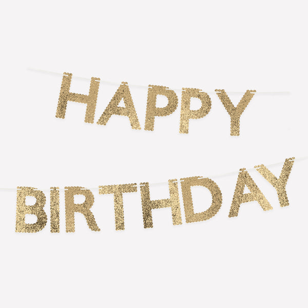 Our gold birthday garland, made from glitter fabric, is perfect to add to your birthday decorations, to reuse year after year. Image1