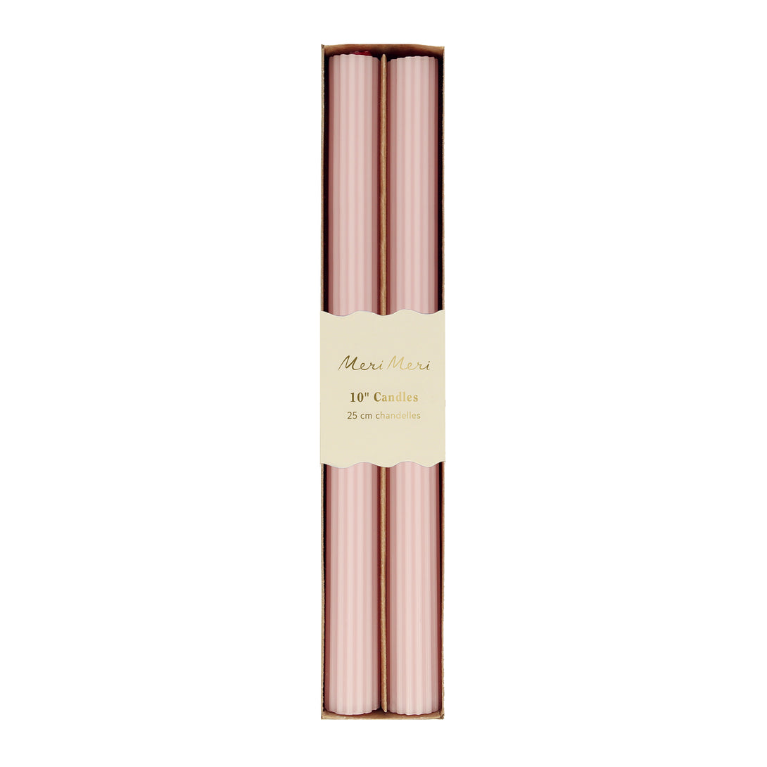 Our tall candles, in a pink colour with ridged details, add a stunning look to any party.