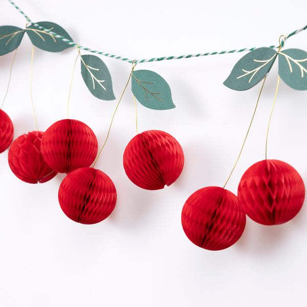 Use our special cherry party supplies for a vibrant look at your parties, our set includes paper plates, cups, napkins and a honeycomb garland. 