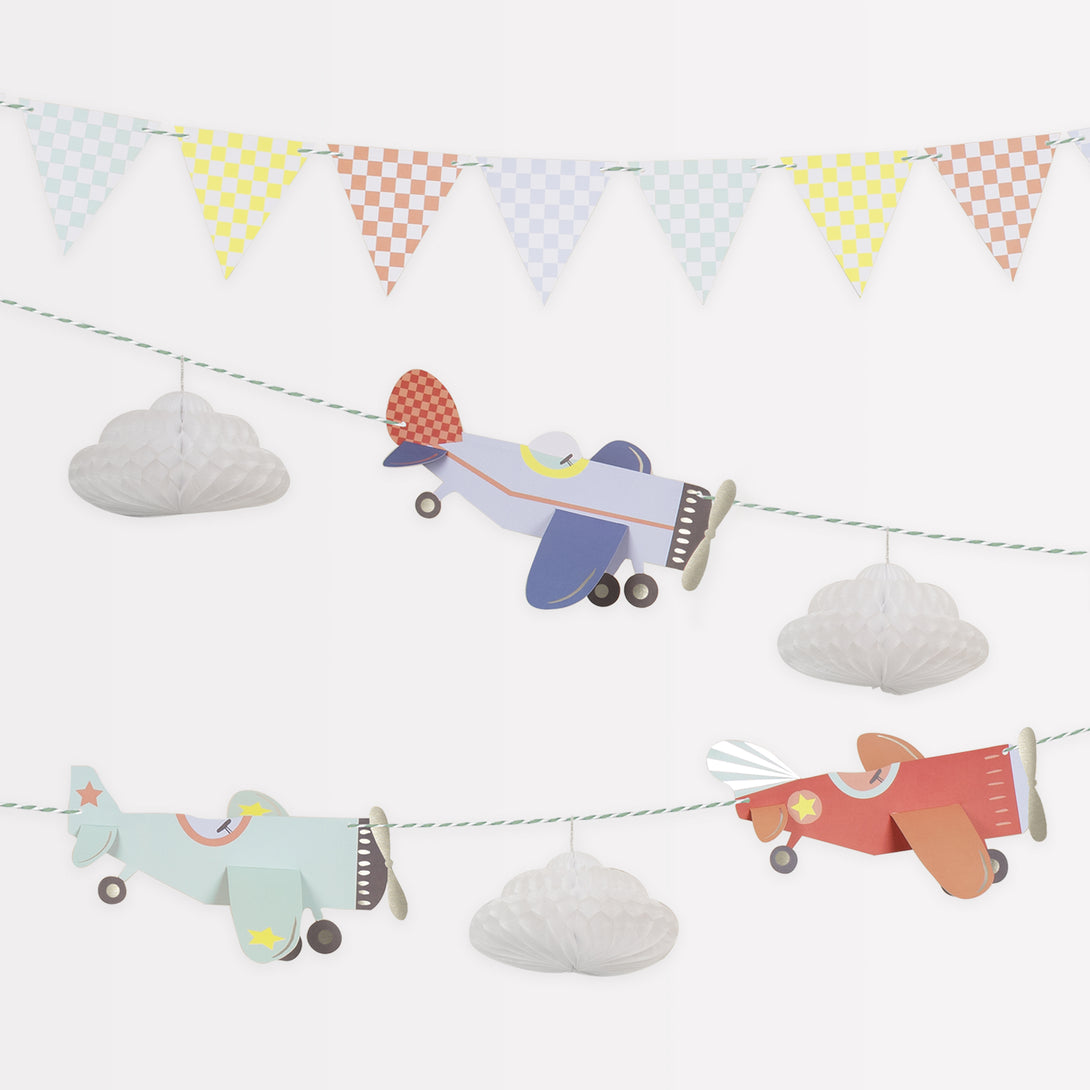 Kids who love airplanes will love our airplane party set which includes an airplane garland, plates, napkins and cups. 