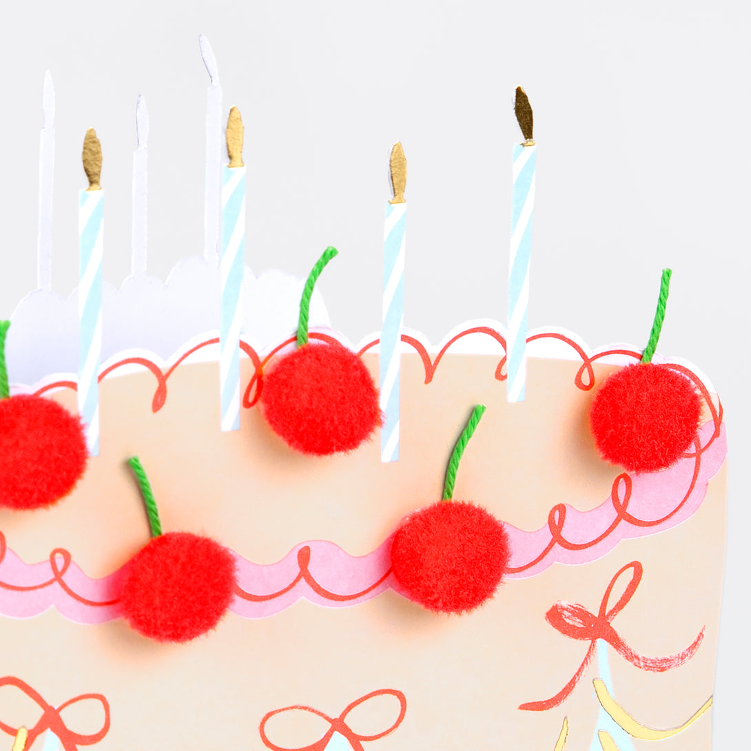 Our birthday cake card, decorated with pompom cherries, is a fabulous way to send birthday best wishes to a special someone.