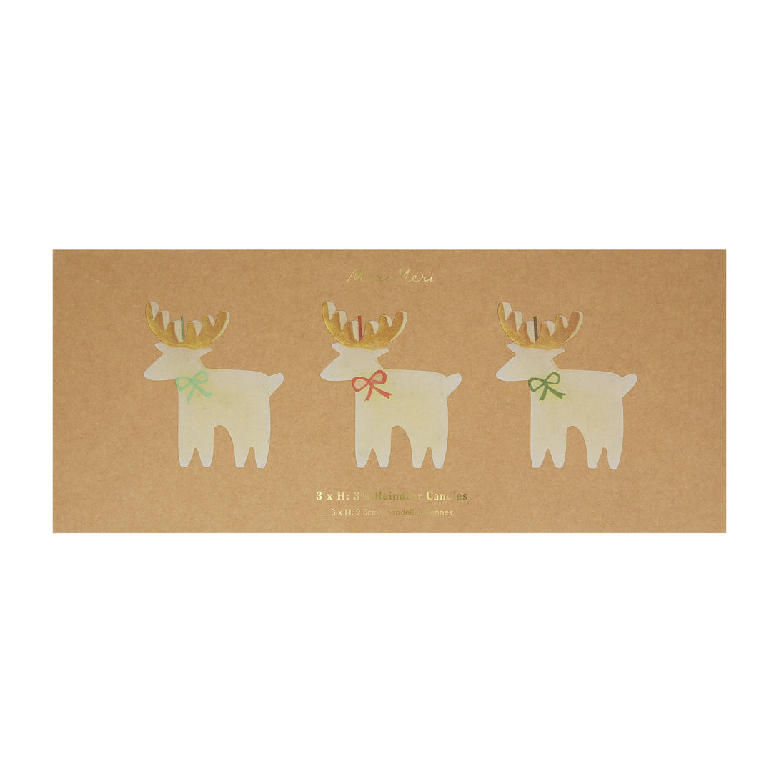 These Christmas table candles are reindeers with on-trend bows, gold details and fabulous coloured wicks, a great host gift.