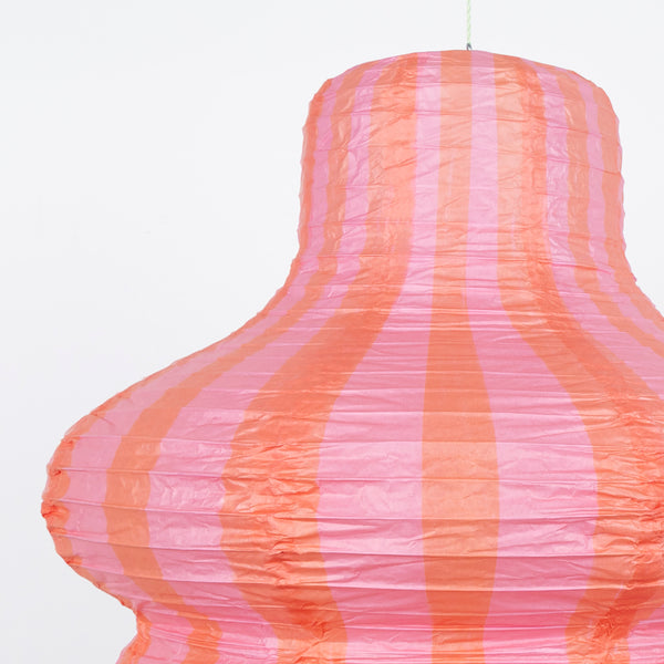 Our paper lanterns, a set of three with orange and blue floral and striped print designs, feature a round, oval and wavy shape. Image2