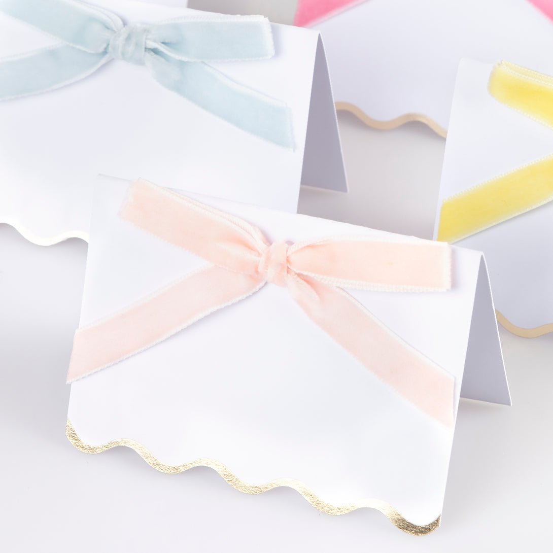 Use our luxury place cards with velvet bows in pastels colours, and shiny gold foil scalloped borders, for special meals like baby showers.