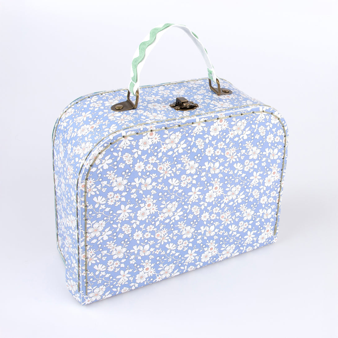 Our mini suitcases feature Liberty floral print designs and stitched card, so are sophisticated travel accessories and storage solutions.