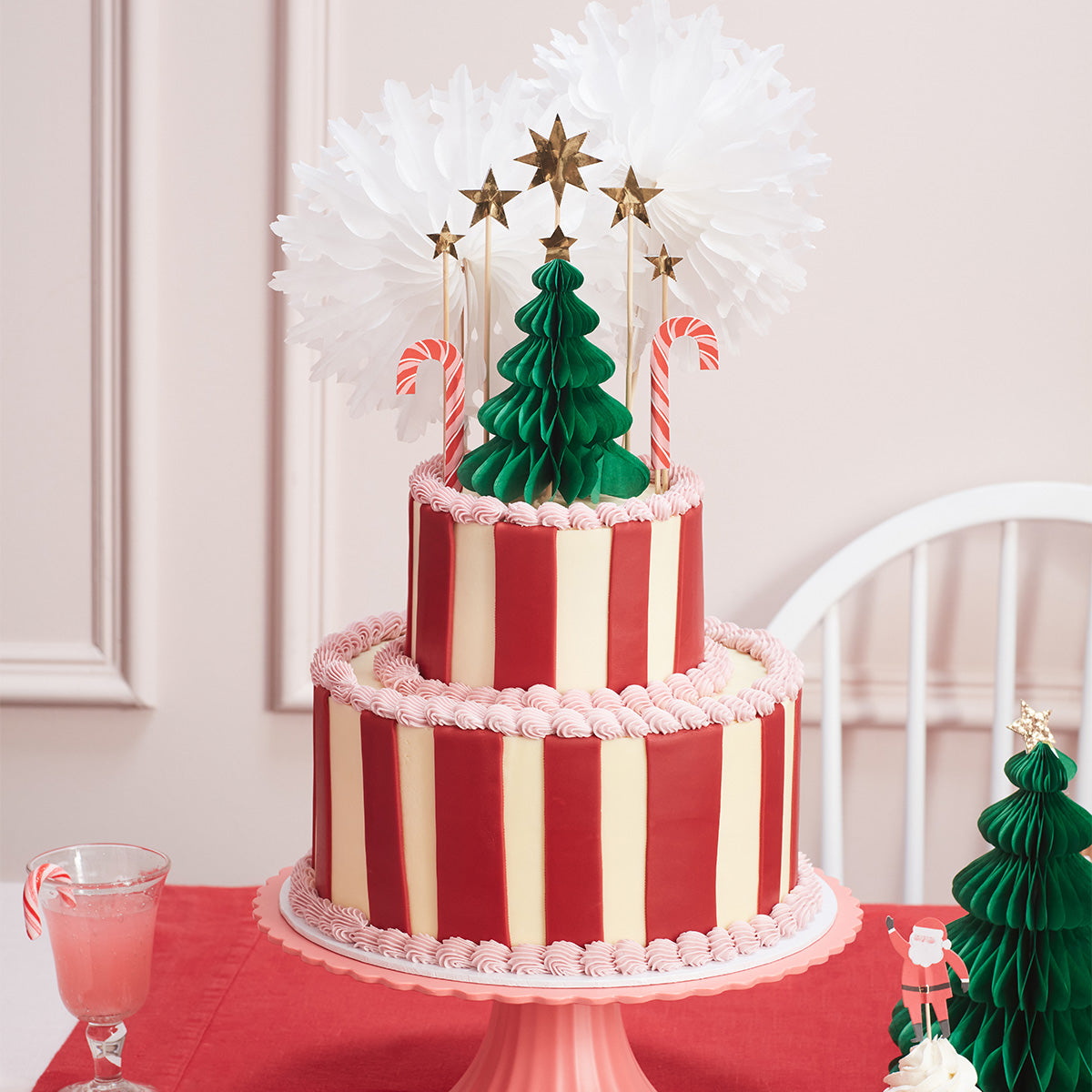 Our Christmas cake decorations include gold glitter star cake toppers and a honeycomb 3D Christmas tree.