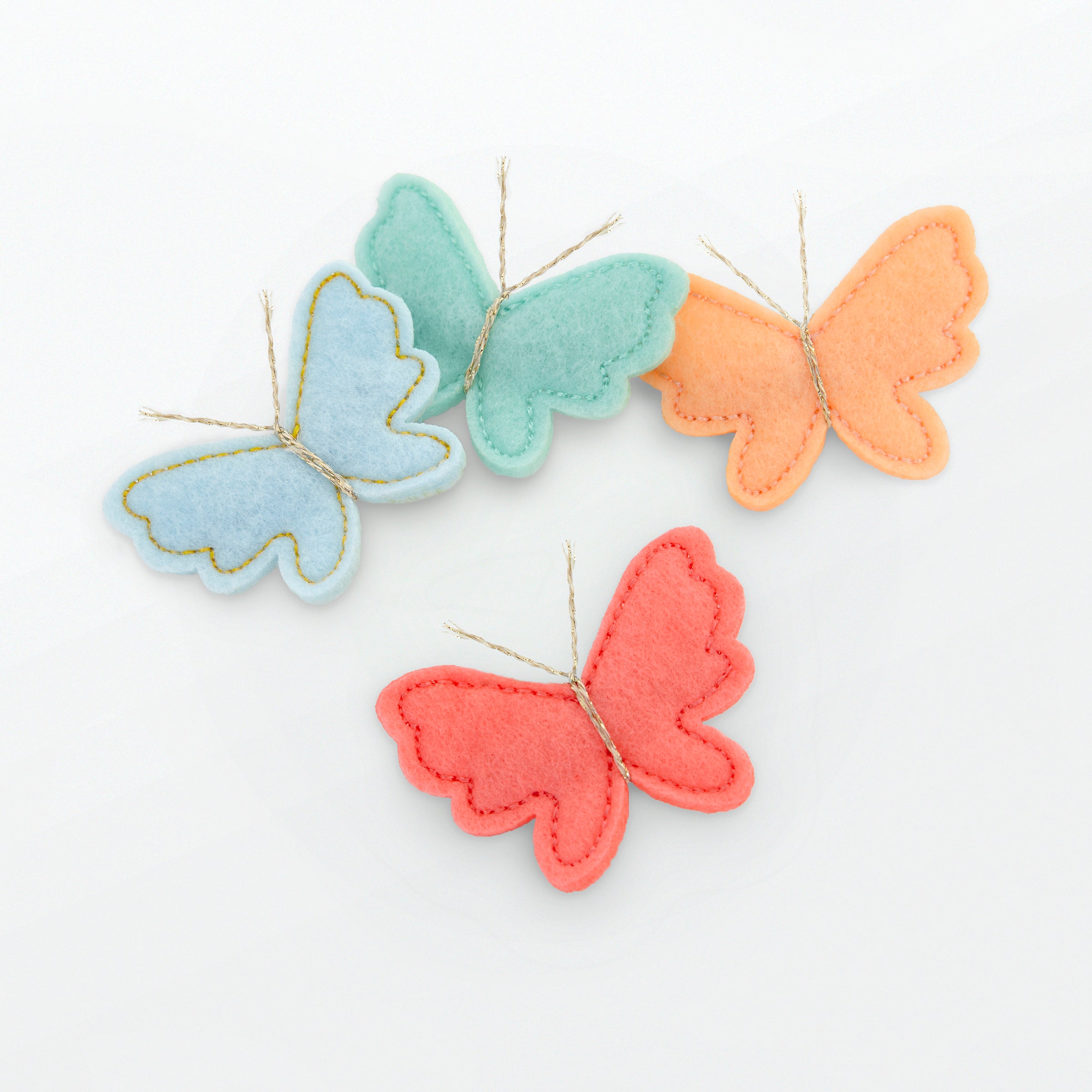 Our butterfly hair accessories are beautifully crafted from colourful felt with sweet metallic gold antennae.