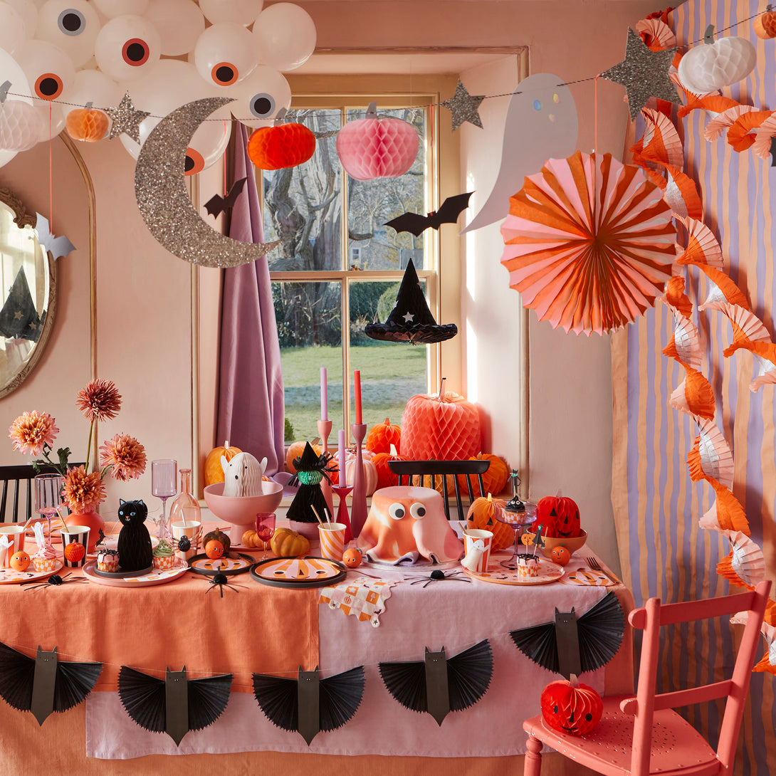 Our paper garland features black bats with 3D wings and big smiles, perfect as kid friendly Halloween decorations.