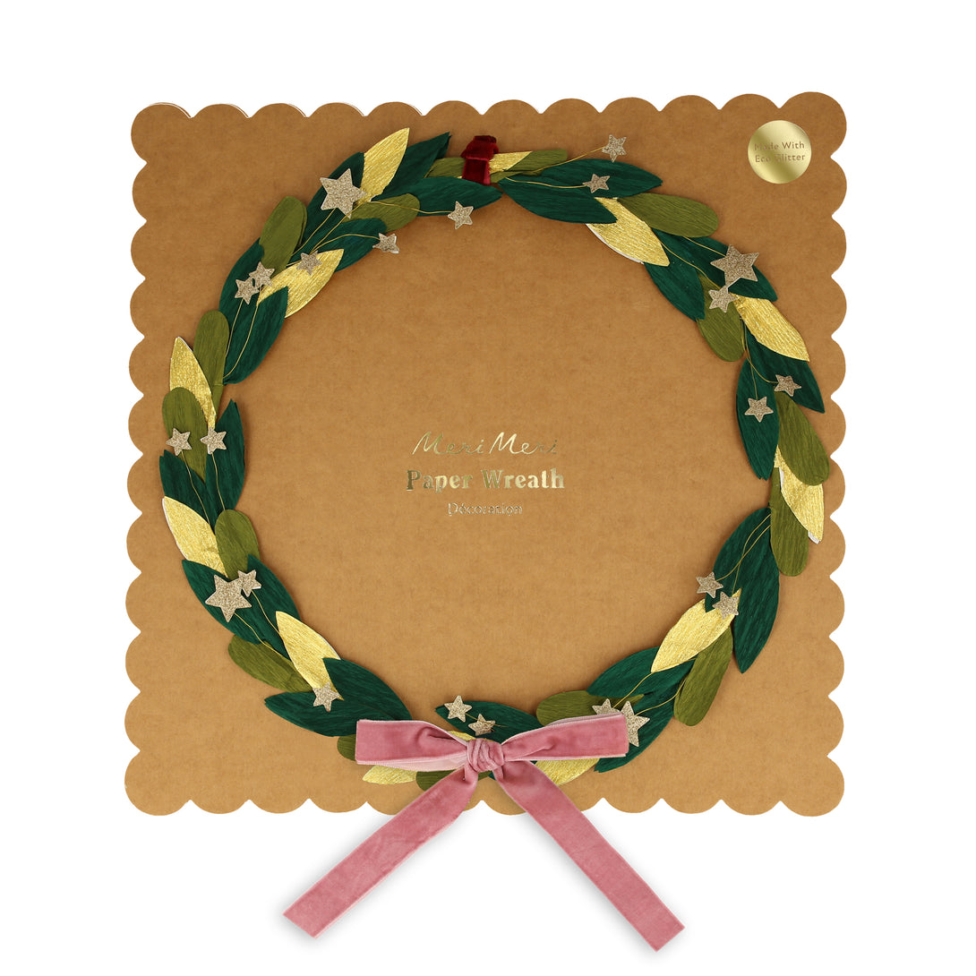 Our star wreath has gold glitter stars, paper leaves and a velvet ribbon and bow.