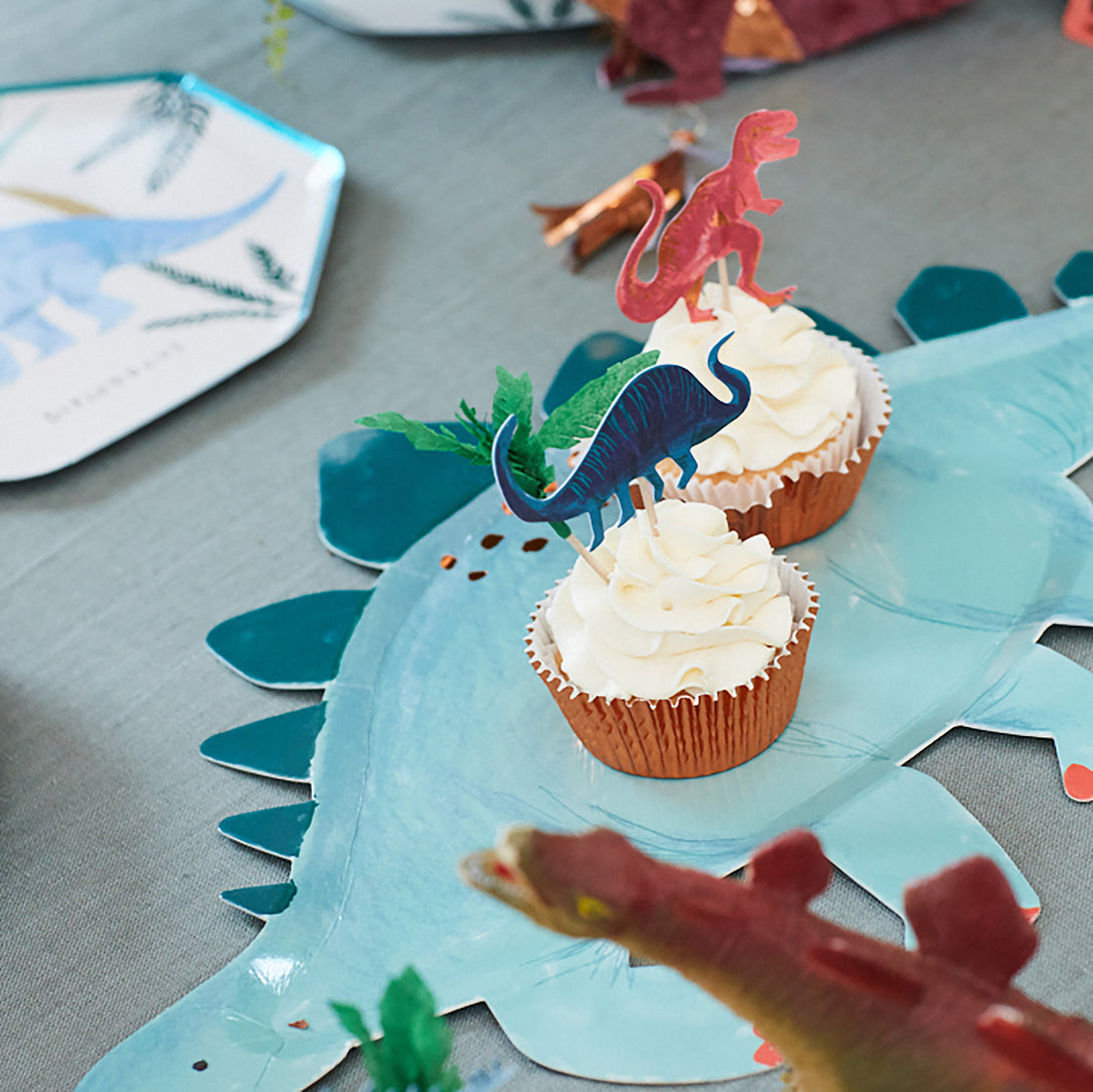 Make dinosaur cupcakes for your dinosaur party with our special dinosaur cake toppers and shiny copper foil cupcake cases.