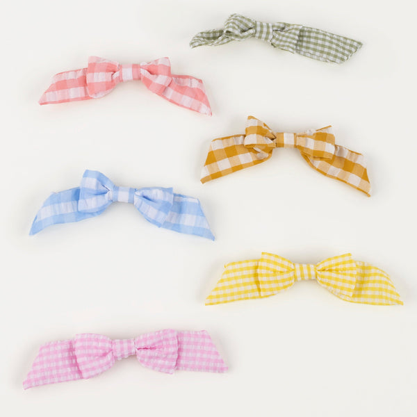 Our stylish kids gold hair clips, with gingham bows, make wonderful kids hair accessories. Image2