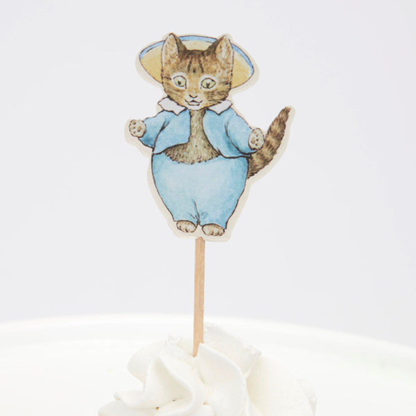 This delightful cupcake kit includes 24 Peter Rabbit characters' toppers with coordinating cupcake cases. Image5