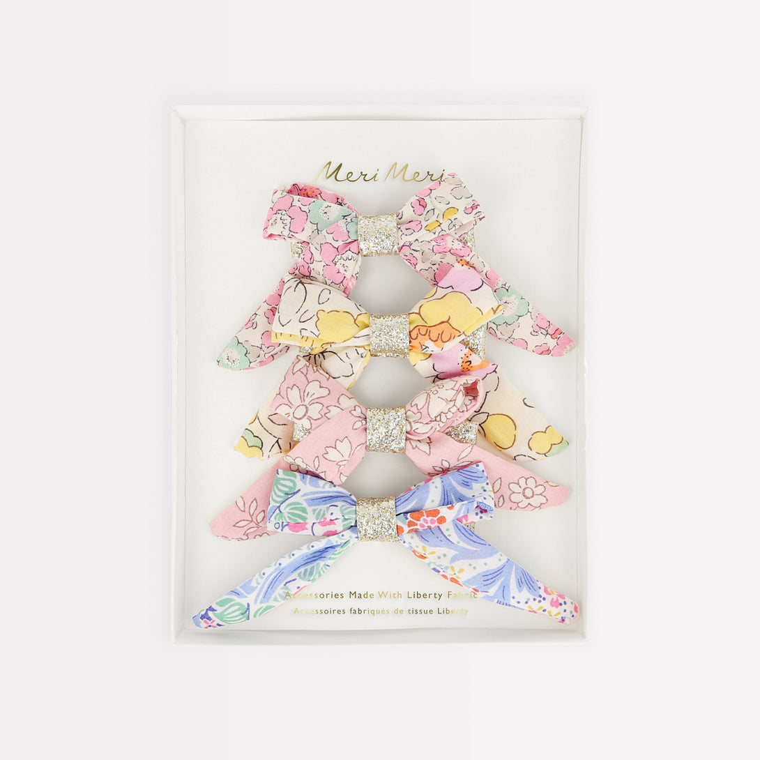 Bows are beautiful, and look amazing on these hair clips as they're crafted with Liberty floral fabric.