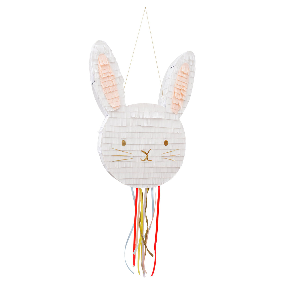 This bunny pinata is beautifully embellished with colourful ribbons and gold foil.