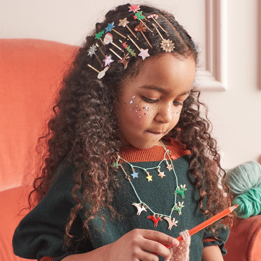 Our Christmas hair accessories, with enamel Christmas icons and gold tone slides, make a wonderful Christmas gift for girls.