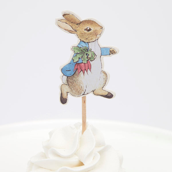 This delightful cupcake kit includes 24 Peter Rabbit characters' toppers with coordinating cupcake cases. Image3