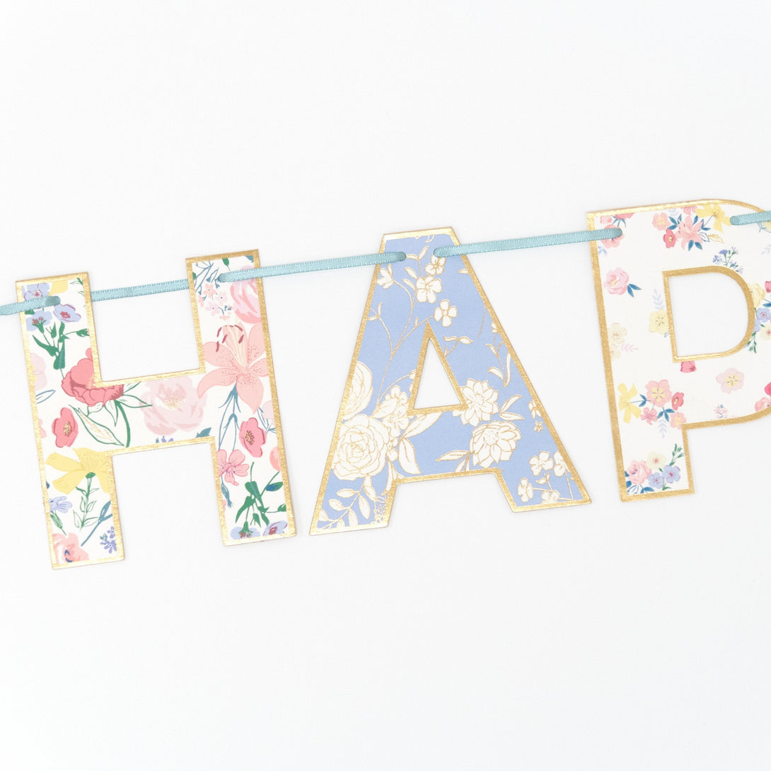 Our party garland spells out the words Happy Birthday with pretty floral designs.