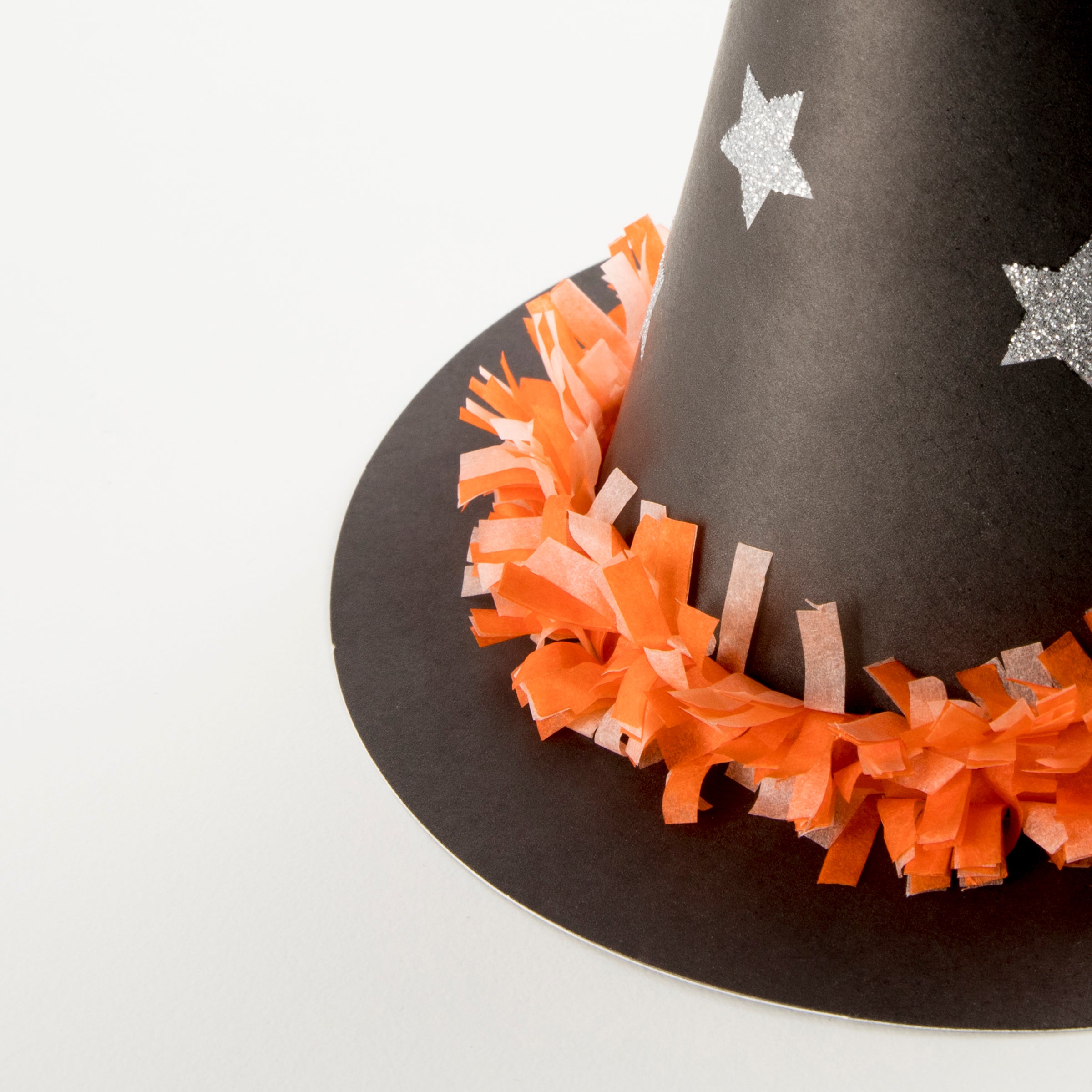 If you're looking for Halloween accessories you'll love these witch hats with bright tissue paper festooning.