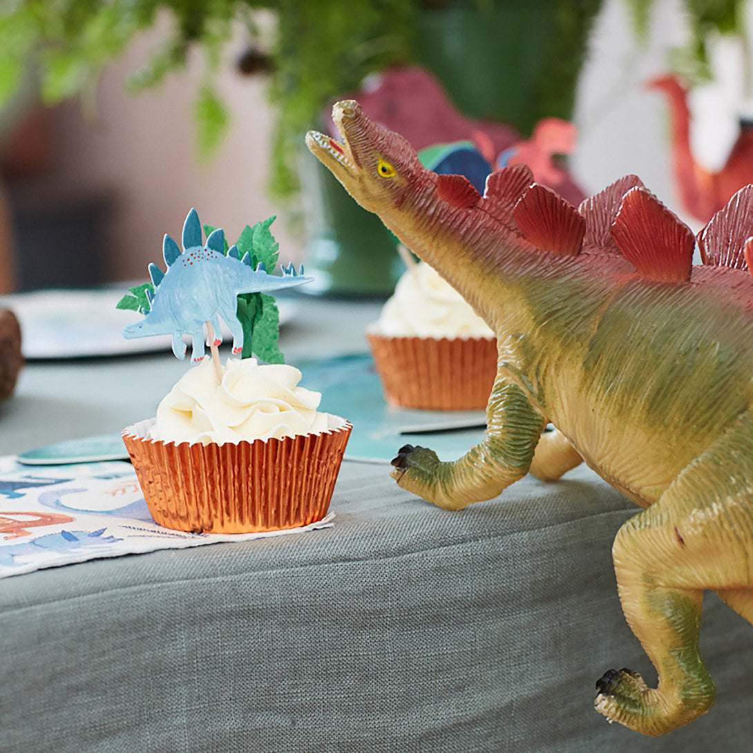 Make dinosaur cupcakes for your dinosaur party with our special dinosaur cake toppers and shiny copper foil cupcake cases.