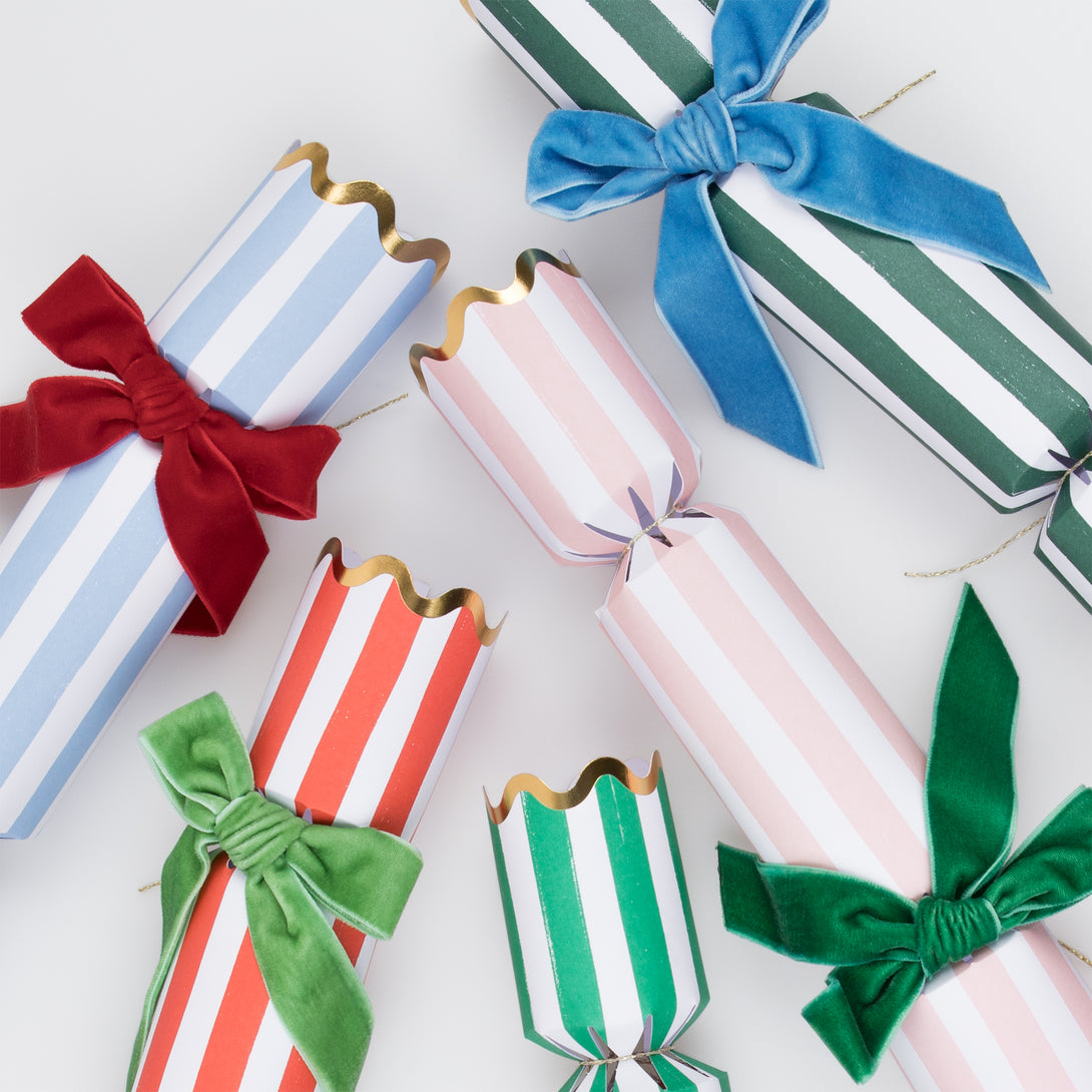 Our luxury crackers, with stripes and bows, contain fun erasers, paper party hats and more.