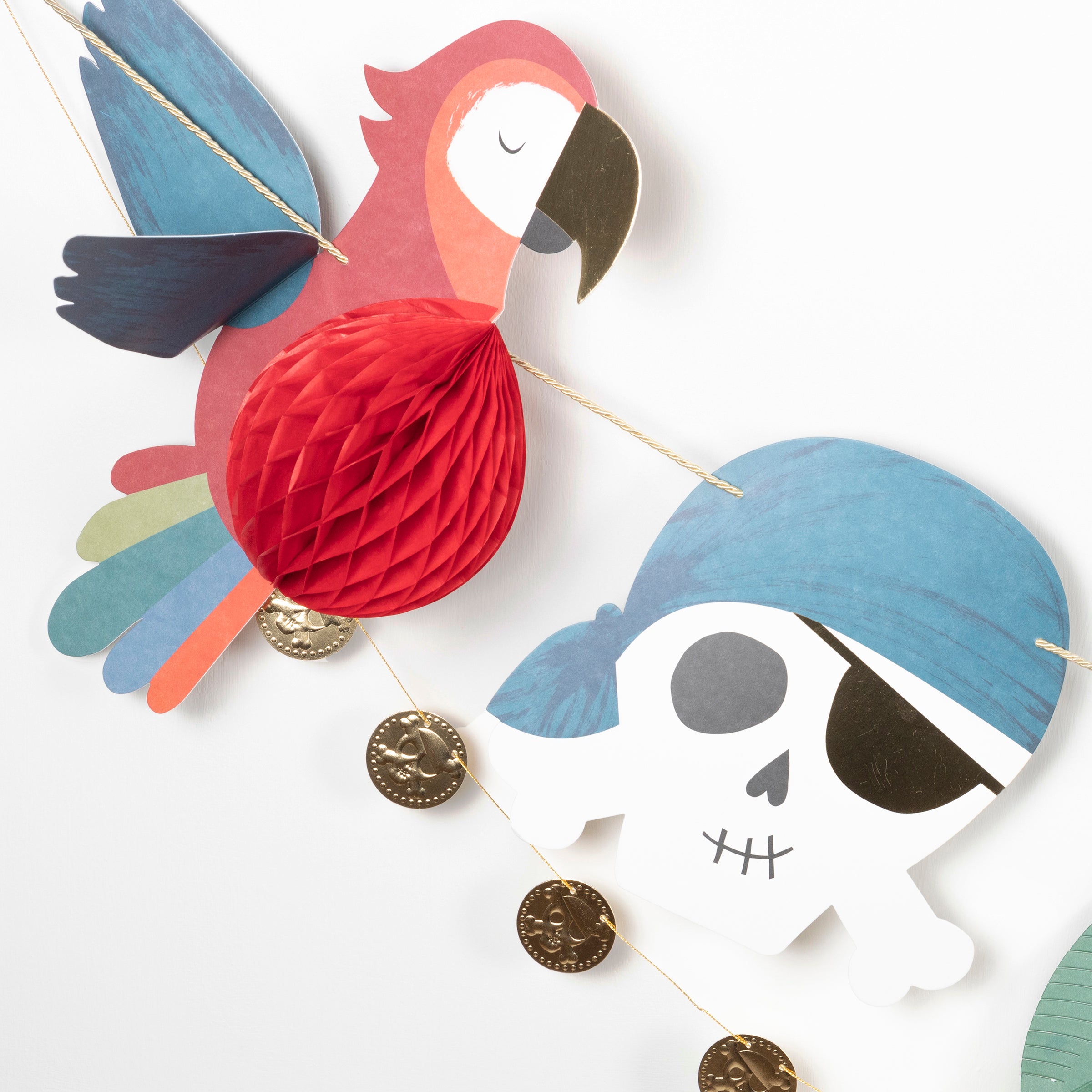 Our party garland is perfect for a pirate birthday party as it features pirate decorations including skull-and-crossbones and a pirate ship.