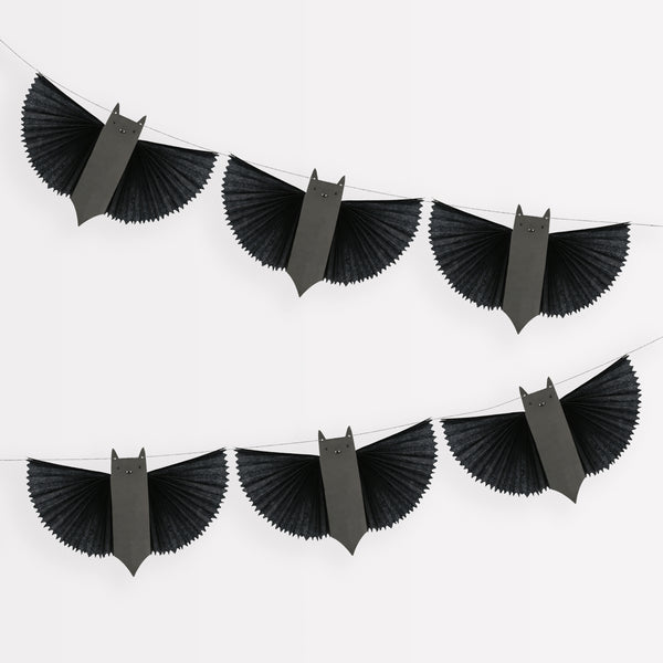 Our paper garland features black bats with 3D wings and big smiles, perfect as kid friendly Halloween decorations.