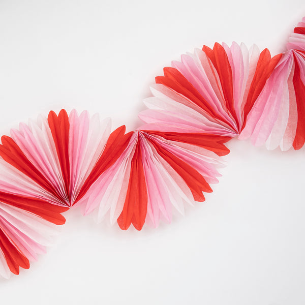 Our honeycomb garland is designed to look like a candy cane decoration, perfect to add to your Christmas party supplies. Image3