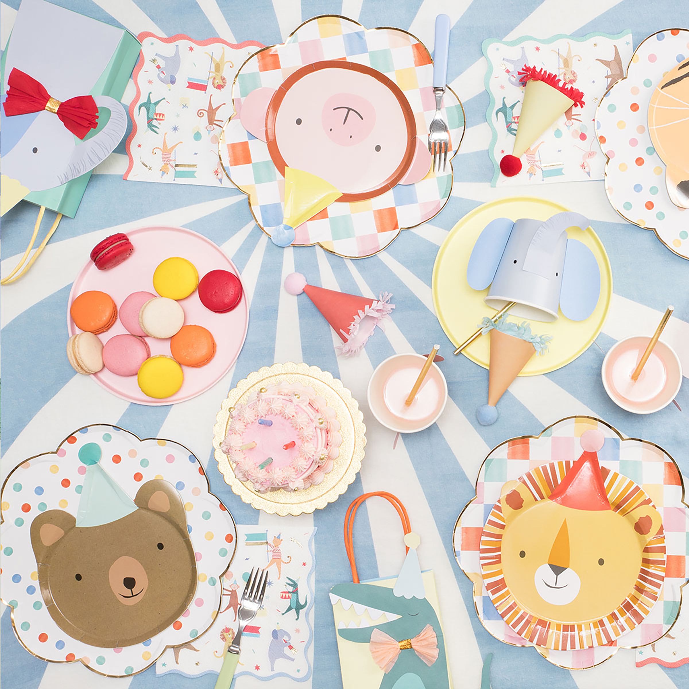 These kids party plates feature a bear plate, monkey plates, tiger plates and lion plates with pom poms.