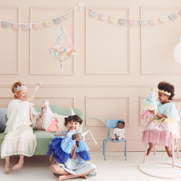 This hanging flower decoration is made from colourful fabric with streamers. Image5