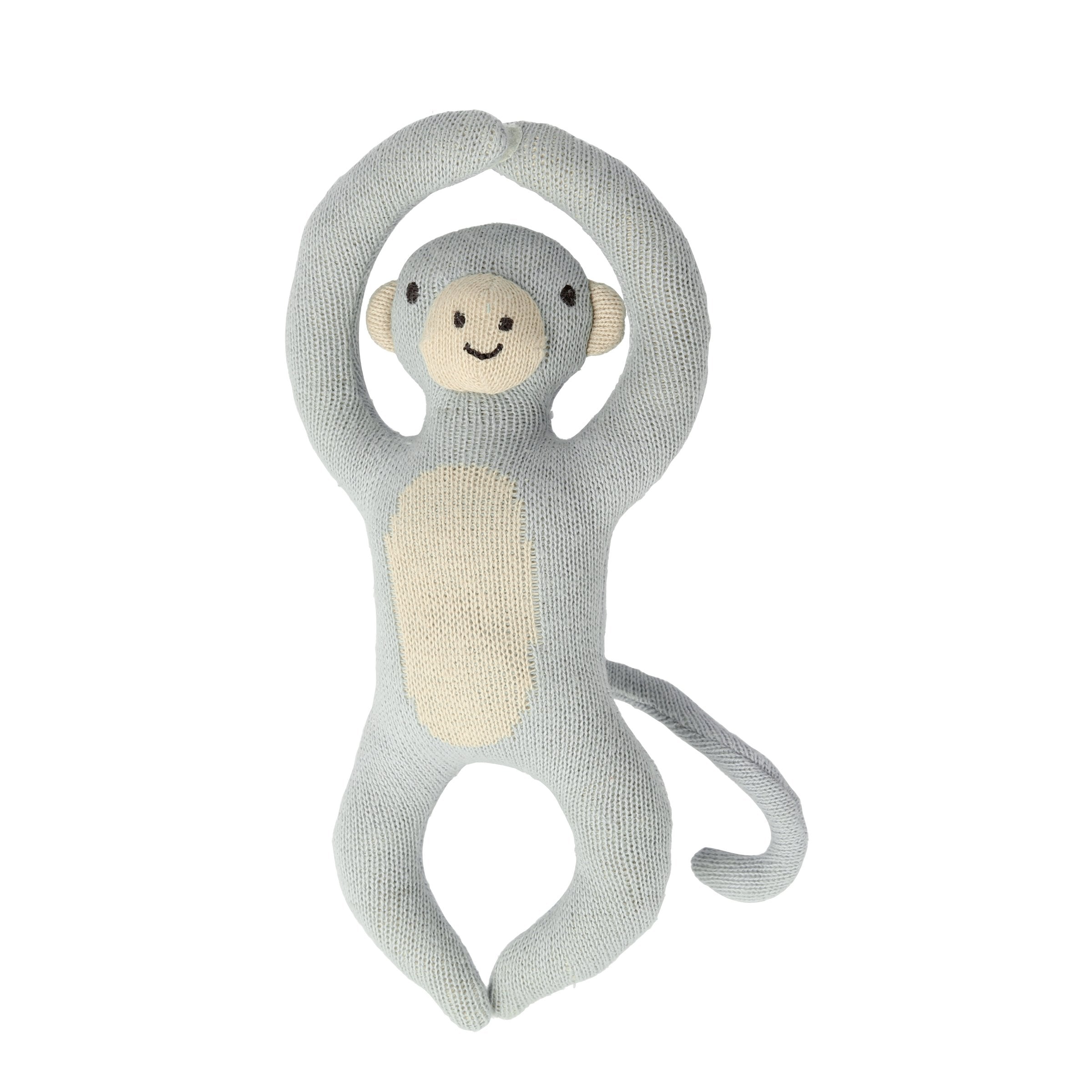 This monkey baby rattle is crafted from organic cotton, perfect as a newborn baby gift.