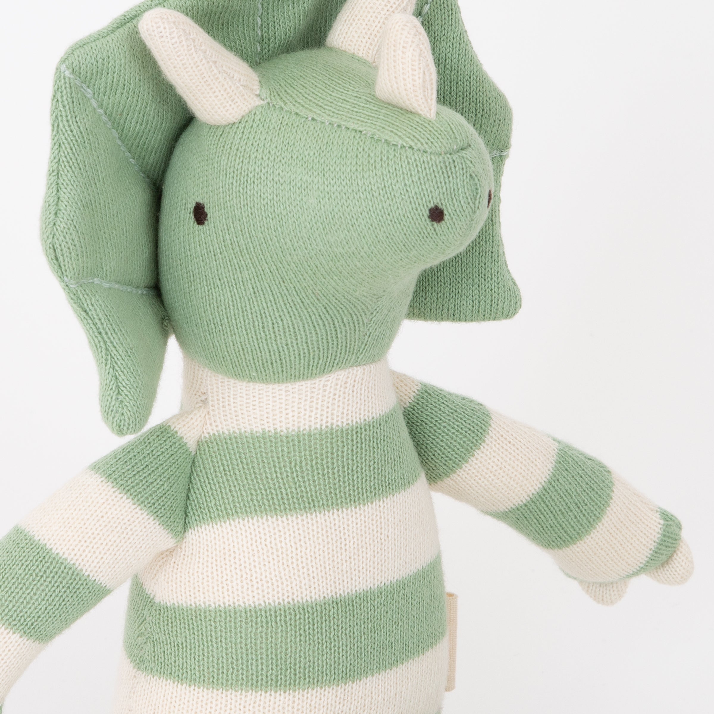 This Triceratops kids soft toy is an organic cotton toy with striped details.