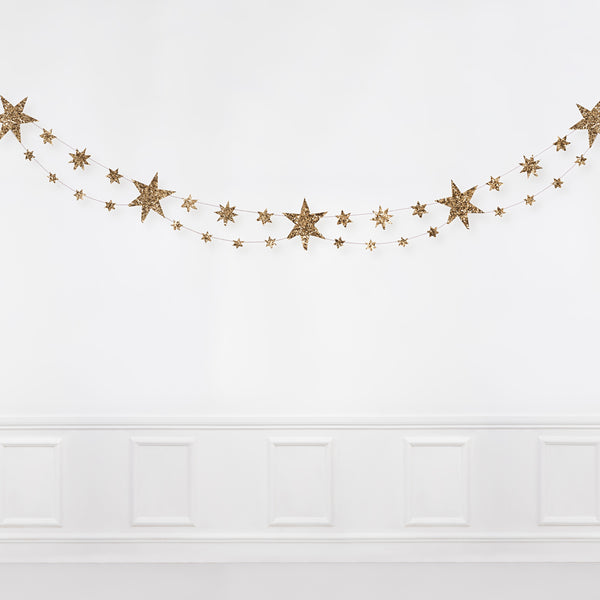 Our star garland is the perfect gold Christmas garland, crafted with gold glitter. Image6