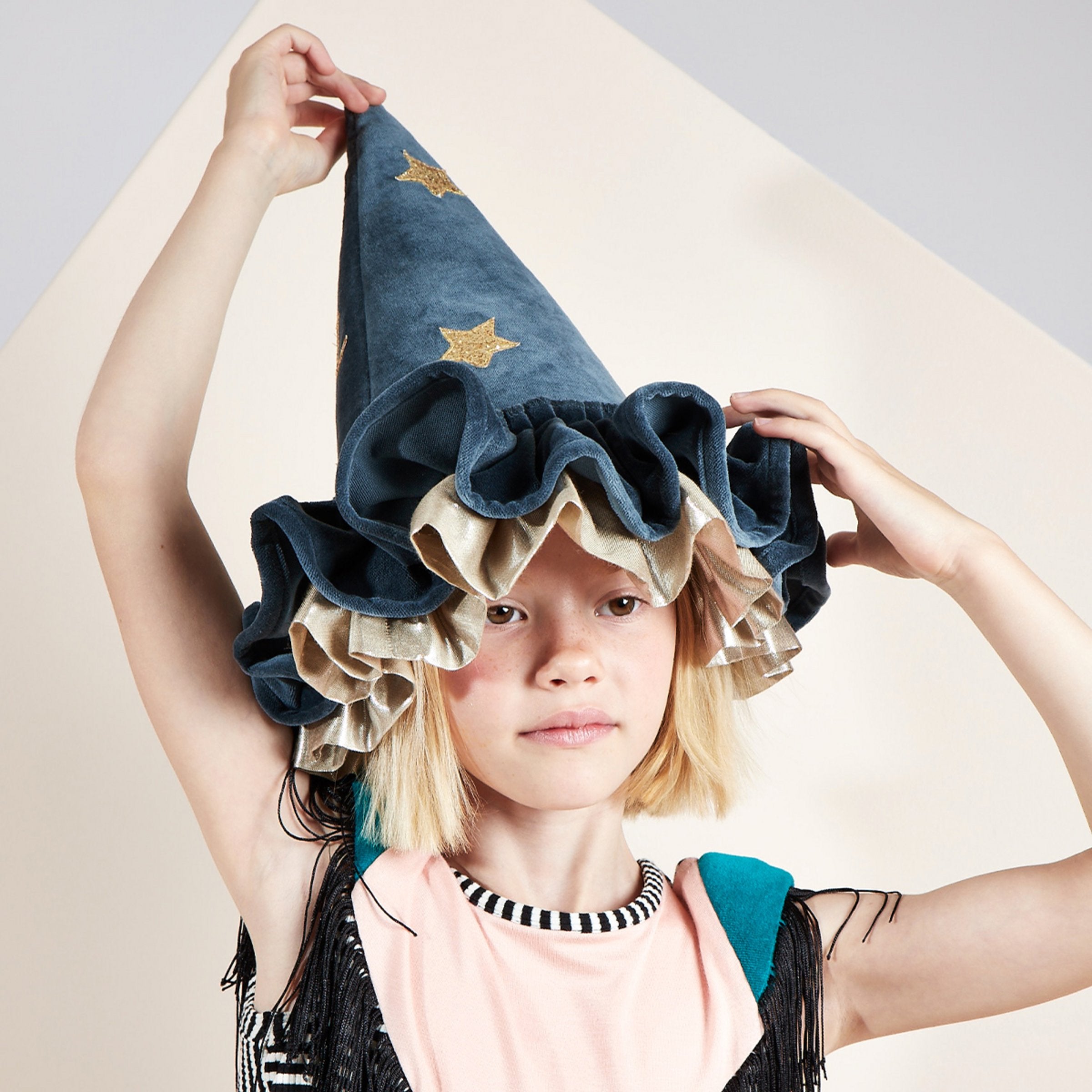 Our pointed hat, crafted from blue velvet, is ideal to add to a witch costume or to wear for dressing up all year.