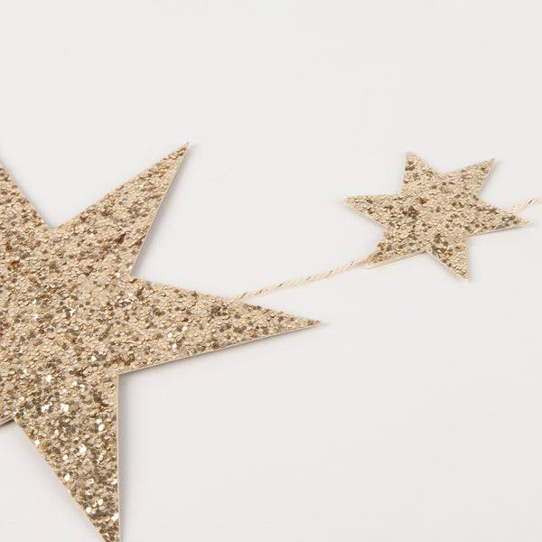 Our star garland is the perfect gold Christmas garland, crafted with gold glitter. Image3
