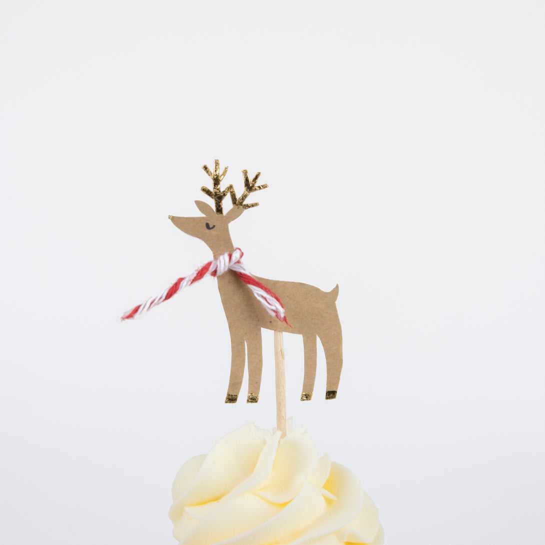 Make Christmas cupcakes with our Christmas cake toppers and cupcake cases, in a kit designed to look like a merry festive house.