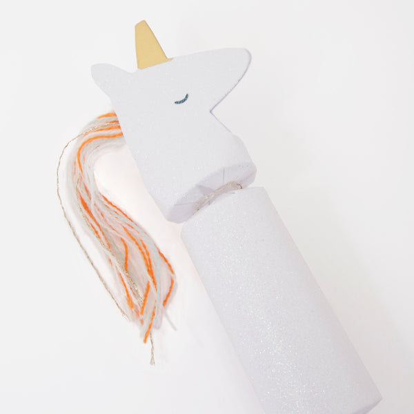 These unicorn party crackers have crystal glitter and gold foil detail, with a yarn tassel mane and tail. Image3