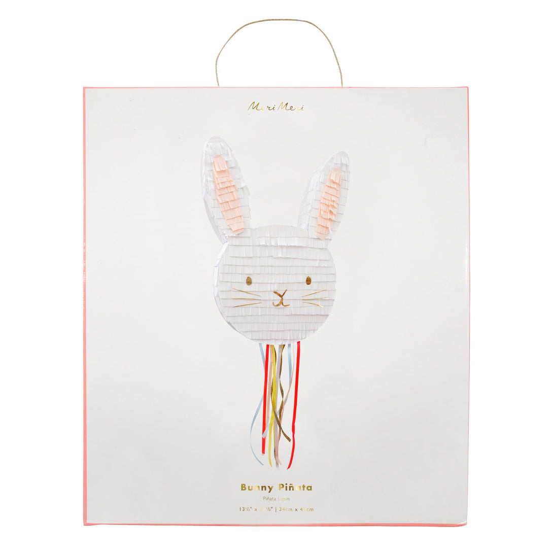 This bunny pinata is beautifully embellished with colourful ribbons and gold foil.