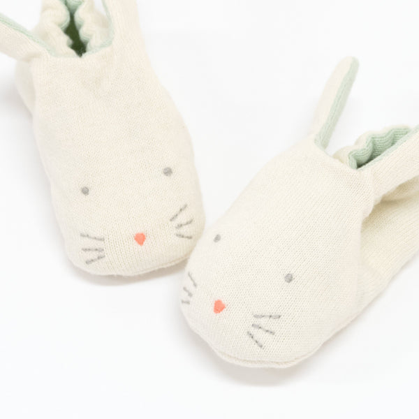 These adorable bunny booties are crafted from knitted organic cotton, with a mint lining, stitched features and floppy ears. Image2