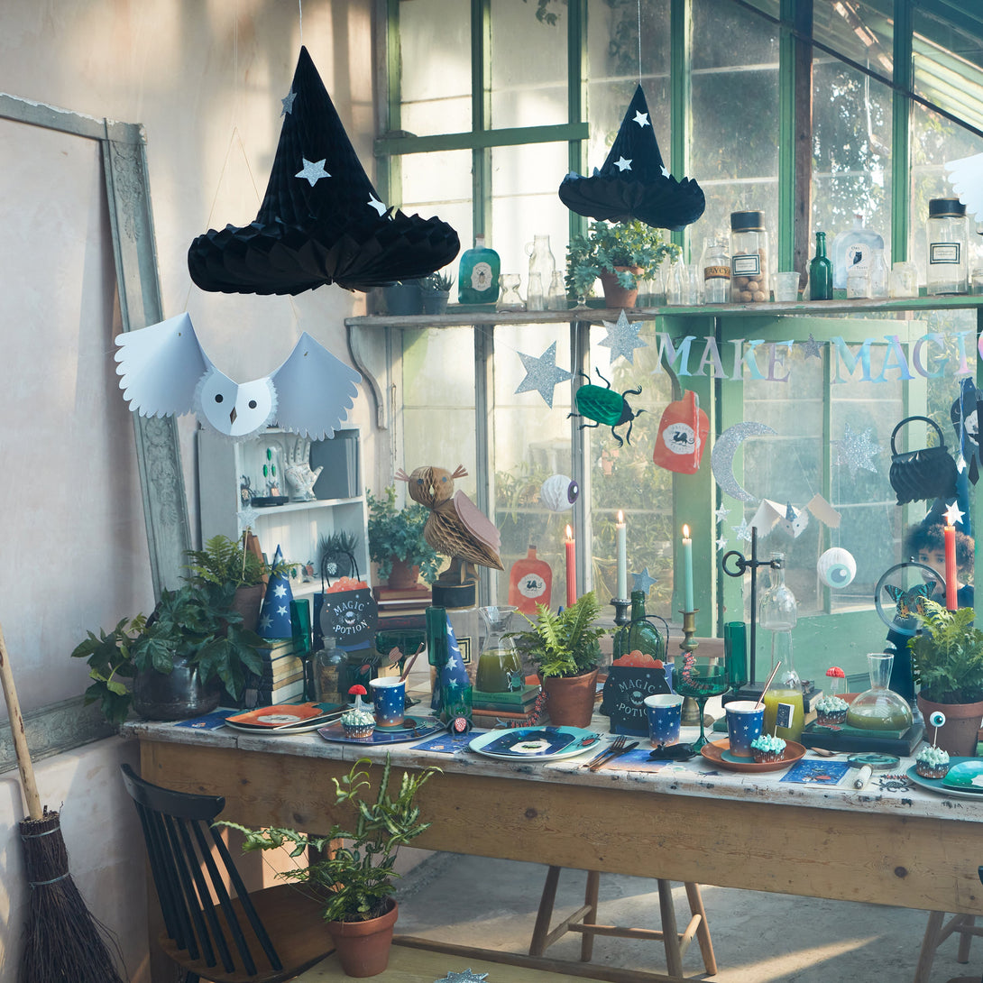 Our witch hats, with silver glitter stars, are the perfect hanging Halloween decorations.