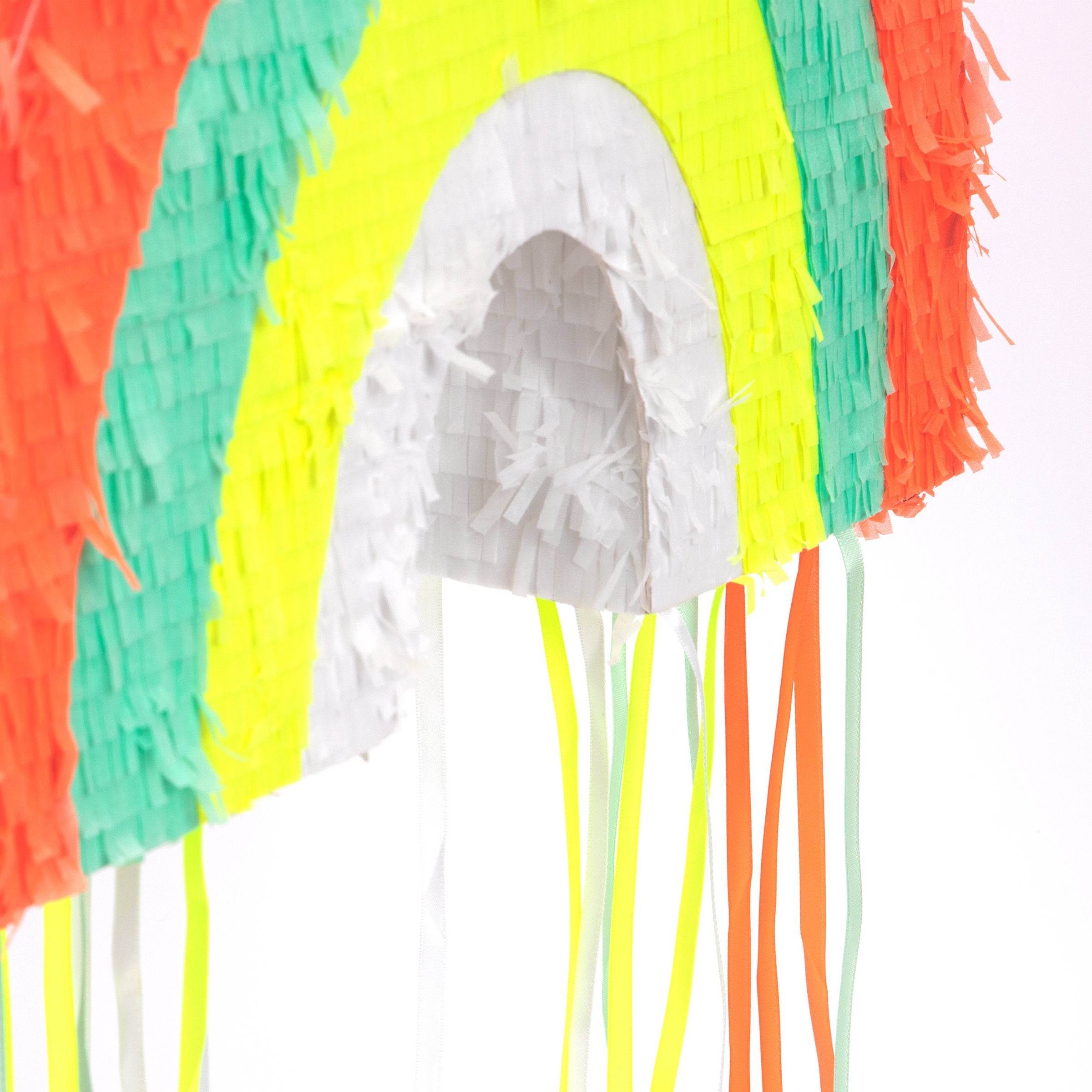 This rainbow pinata is beautifully decorated with colourful stripes and hanging ribbons.