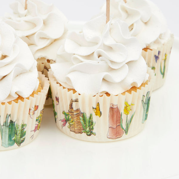 This delightful cupcake kit includes 24 Peter Rabbit characters' toppers with coordinating cupcake cases. Image7