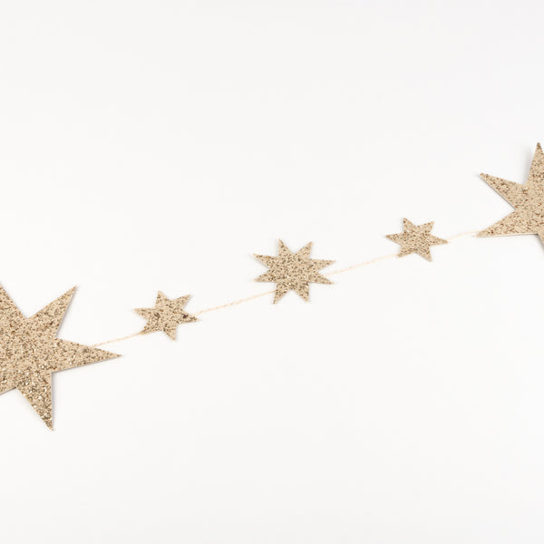 Our star garland is the perfect gold Christmas garland, crafted with gold glitter. Image4
