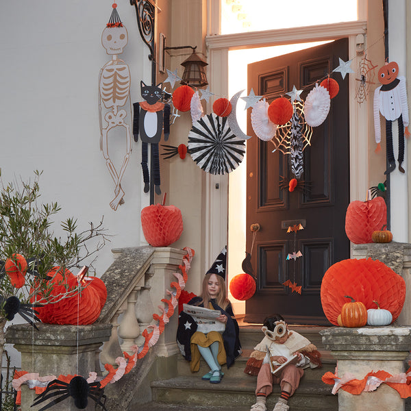 Our Halloween wall decoration features spiders, cobwebs, pinwheels, stars, honeycomb balls and a moon. Image2