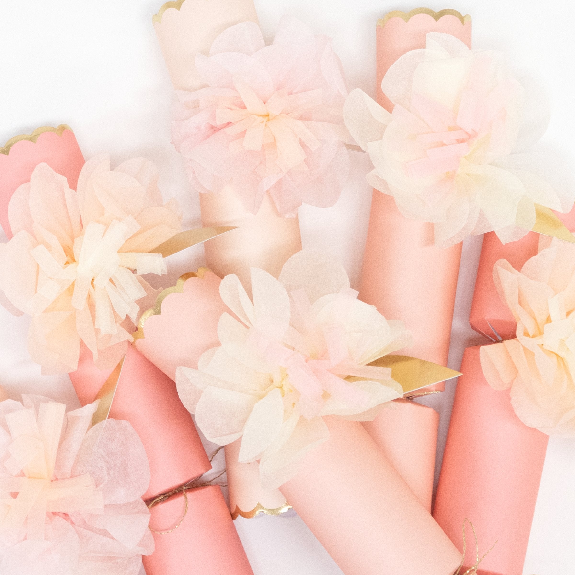 These pretty pink crackers are decorated with tissue paper flowers, and contain a tiara and sparkling glitter brooch.