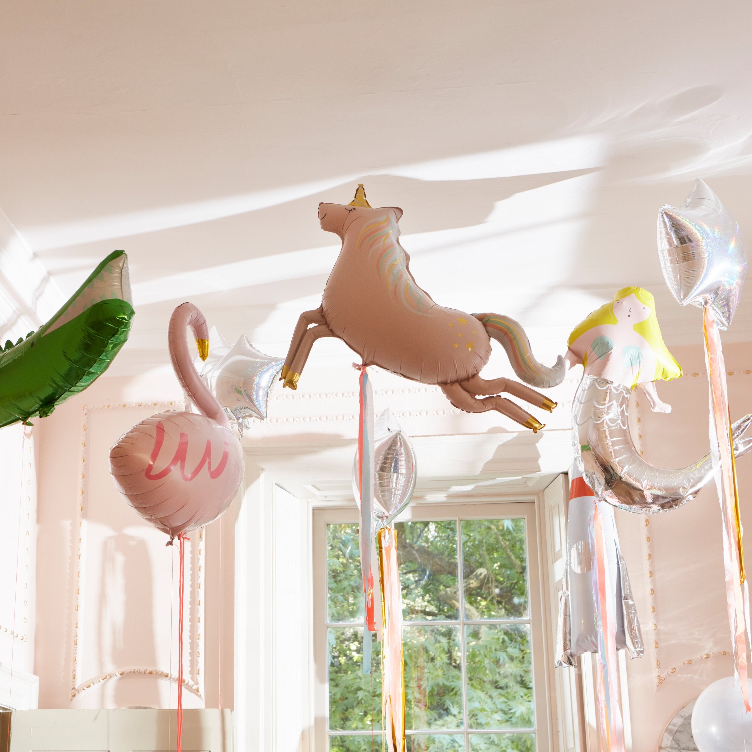 The unicorn balloon has printed foil details, a neon cord to hang it up with, and beautiful streamers for a special touch.